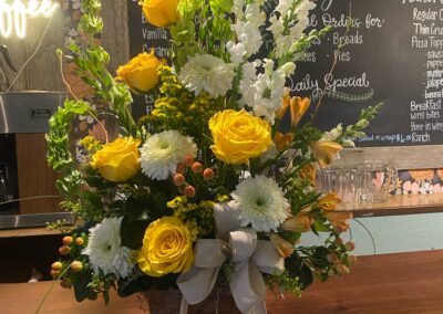 yellow flowers on the table